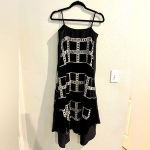 Light and breezy maxi dress with handkerchief hem and beautiful lace overlay.